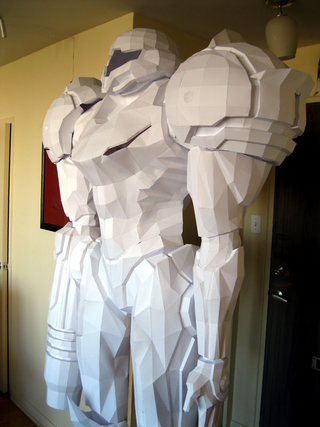 Illustration for article titled Stand in Awe of This Life-Sized Metroid Statue (Made of Paper!)